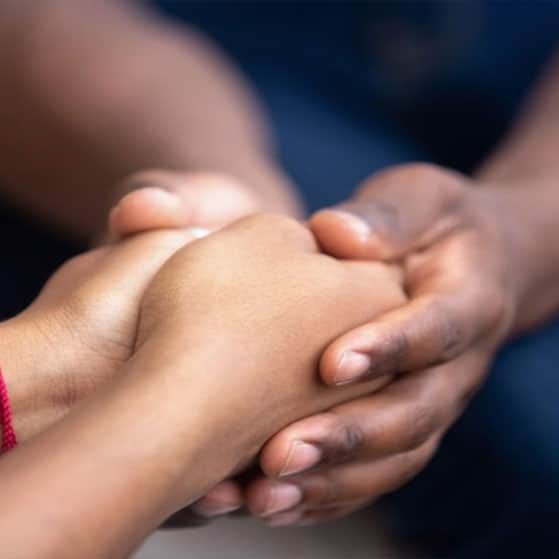 Holding Hands Giving Psychological Treatment — Plume Consulting Hypnotherapist in Western Sydney