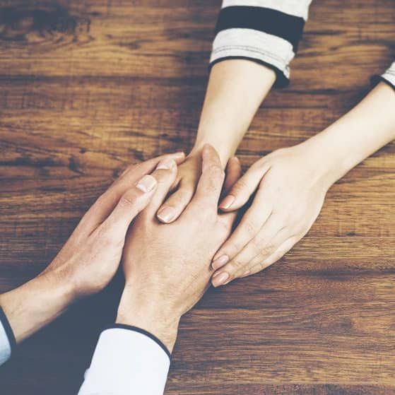 Holding Hands Man And Woman — Plume Consulting Hypnotherapist in Blacktown