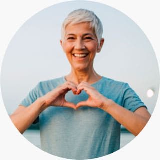 Woman Heart Sign Mobile — Plume Consulting Hypnotherapist in Western Sydney